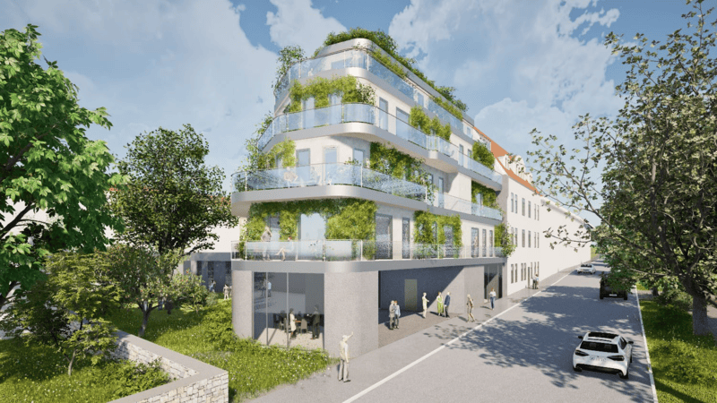 Modernes mehrstöckiges Wohngebäude mit großen Balkonen und viel Begrünung an der Fassade in einer städtischen Umgebung